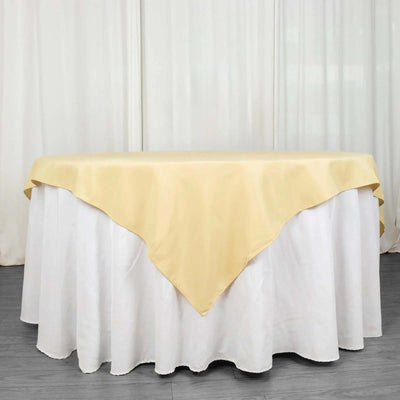Yellow tablecloth draped elegantly over a round white table.