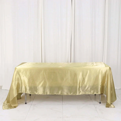 Gold satin tablecloth draped elegantly over a table.