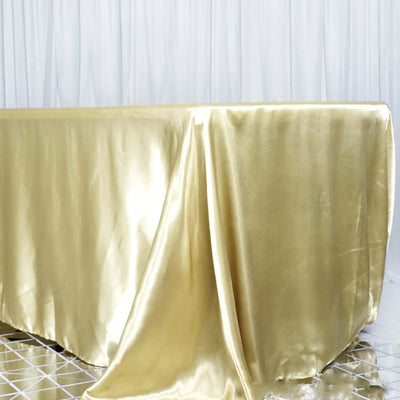 Gold satin tablecloth draped elegantly on a table
