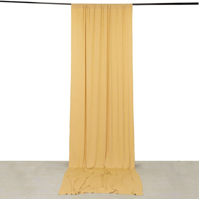 Yellow fabric backdrop draped on a studio frame.