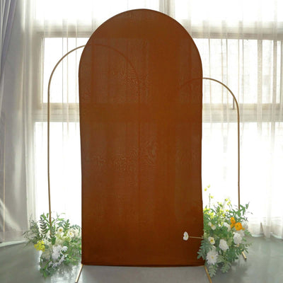 Bronze arch backdrop with floral accents for events and photography.