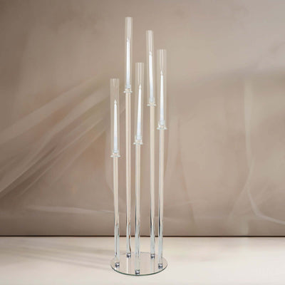 Modern glass candle holder with multiple tapered sections.