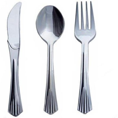 Stainless steel knife, spoon, and fork set on a plain white background