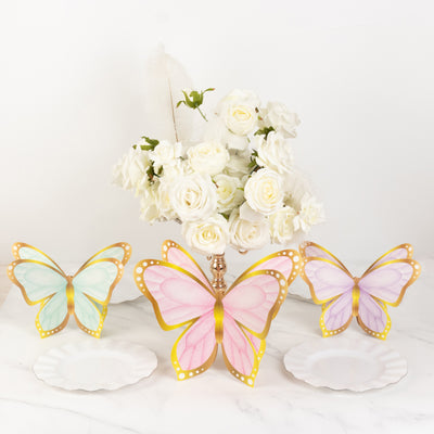 Decorative butterflies and floral arrangement on a table setting.