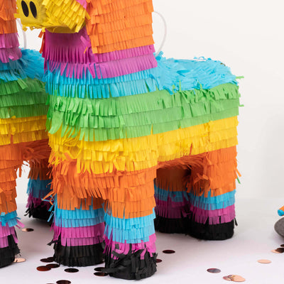 Colorful party piñata in vibrant rainbow colors.