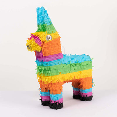 Colorful unicorn piñata in bright rainbow stripes