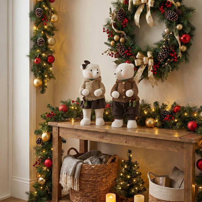 Festive Christmas bears on decorated holiday wreath and garland display