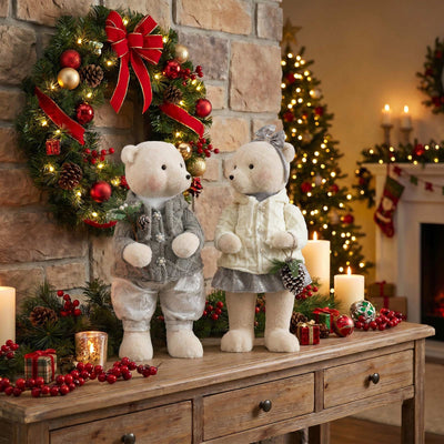Christmas teddy bear figurines with wreaths and festive holiday decor inside a home