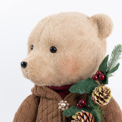 Festive teddy bear with pinecone and berry holiday decoration