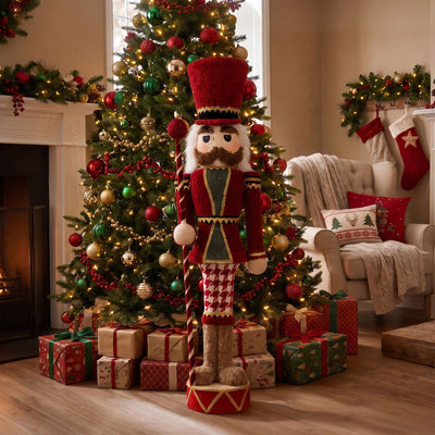 Nutcracker by Christmas tree in festive living room with gifts and stockings