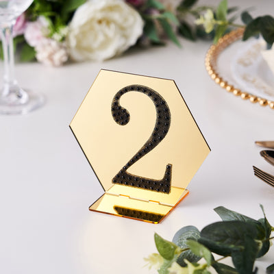 Gold hexagonal table number 2 stand with black embellishments