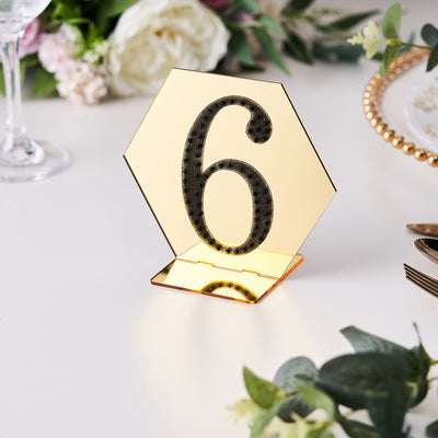 Gold hexagonal table number 6 display for events and weddings