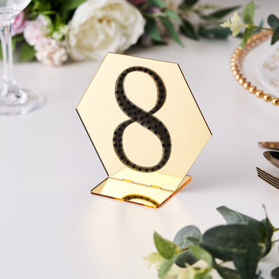 Gold hexagonal table number 8 holder for weddings and events