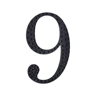 Black number 9 with a textured design on a white background