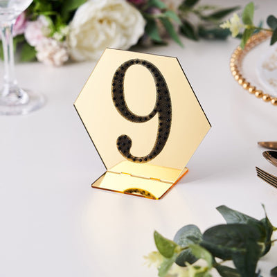 Gold hexagon table number sign with black glitter, number 9.