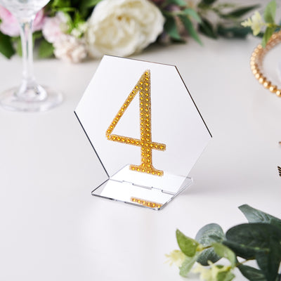 Hexagon table number 4 with gold rhinestones on a clear base