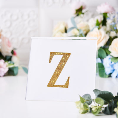 Gold letter Z decorative plaque on a white background.
