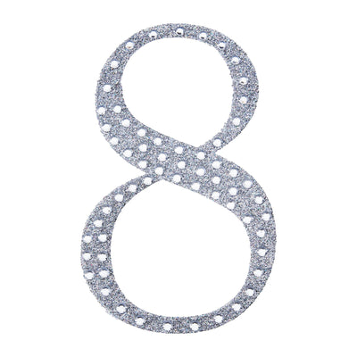 Glittery silver number 8 decoration on a white background