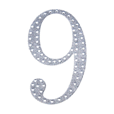 Silver glitter number 9 cutout on a white background