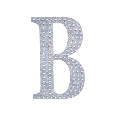 Silver rhinestone letter B cutout on a plain background