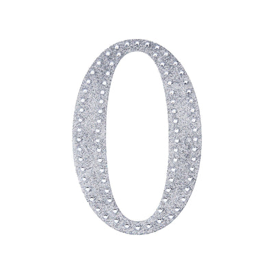 Silver glitter number "0" decoration on a plain white background.