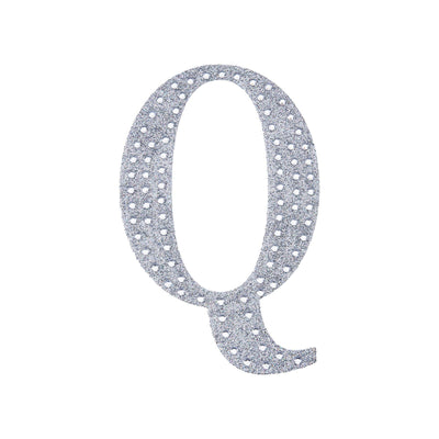 Glittery letter Q cutout on a white background