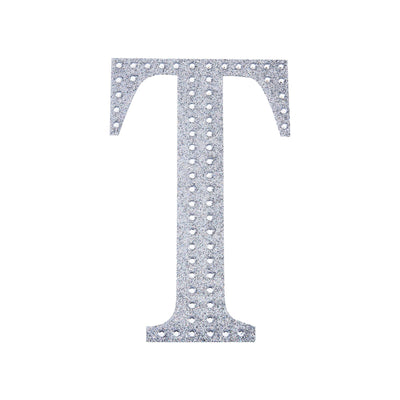 Silver rhinestone letter T cutout on a white background