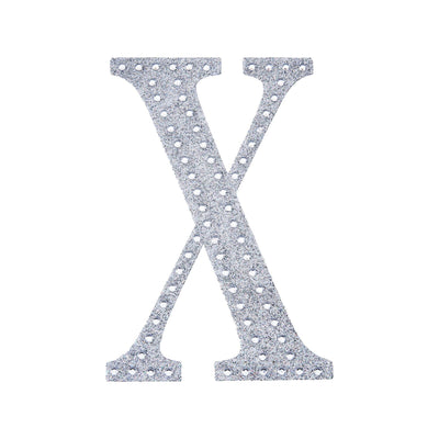 Silver glitter letter "X" on a plain white background.