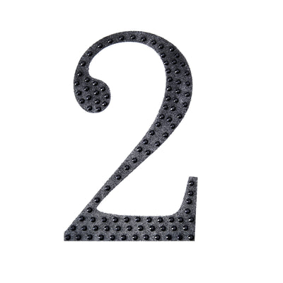 Black textured number two cutout on a plain white background.