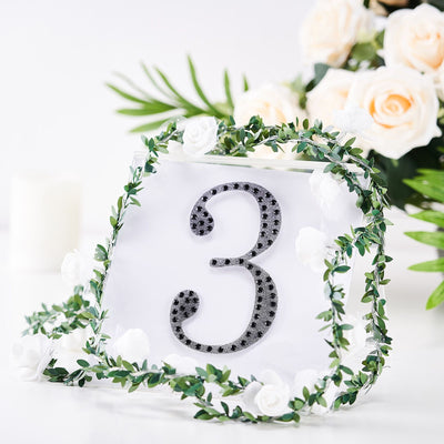Table number 3 with floral decoration and greenery