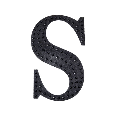 Black textured letter "S" with raised dots on a plain white background.