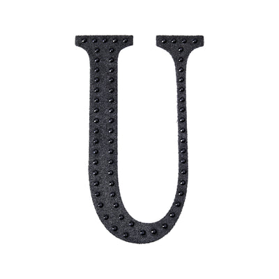 Black foam letter "U" with textured surface
