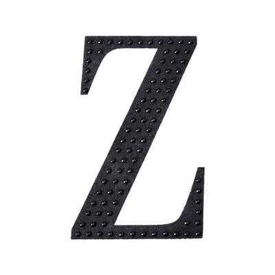 Black letter "Z" with studded texture on a white background.
