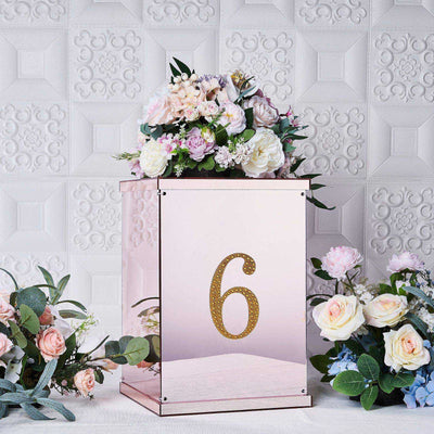 Elegant floral arrangement in a mirrored box with the number 6.