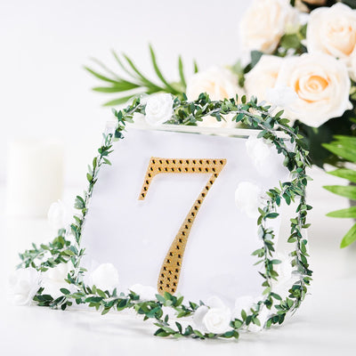 Table number 7 with gold detailing and floral greenery decoration