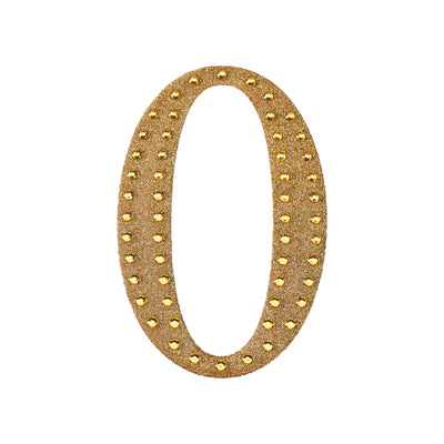 Gold glitter number "0" with studded details on a white background.