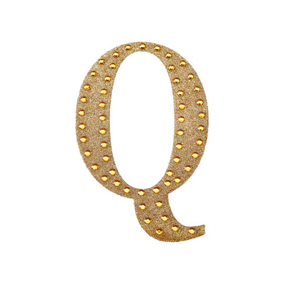 Gold glitter marquee letter "Q" with lights