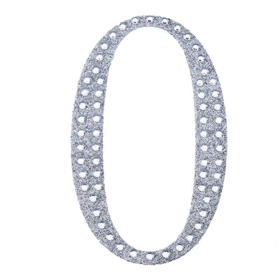Silver glitter number zero cutout on a plain background