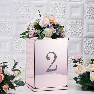 Decorative rose gold table number with flowers, perfect for events and weddings.