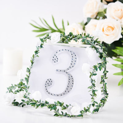 Table number three with decorative greenery and flowers for events.
