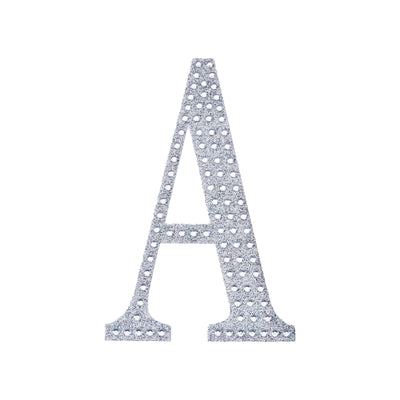Silver glitter letter A cutout on a plain background.