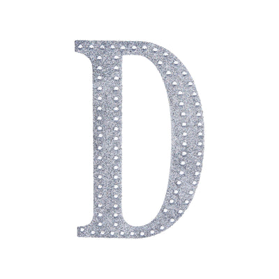 Rhinestone letter "D" in silver on a white background.