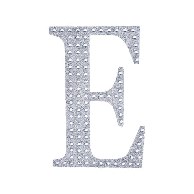Glittery silver letter "E" cutout on a white background