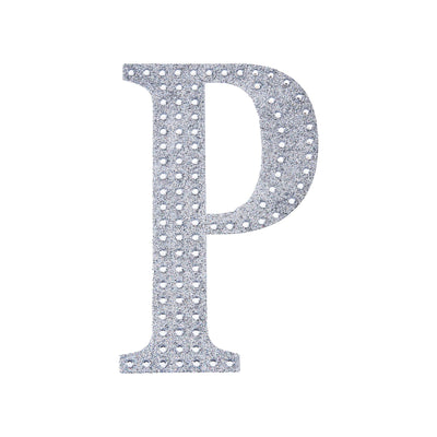 Silver rhinestone letter "P" on a plain background