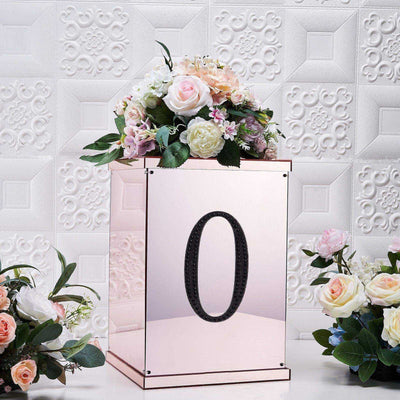 Mirrored floral arrangement box with number "0" and decorative flowers.