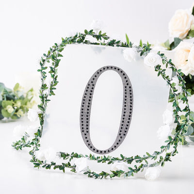 Decorative number 0 with floral frame on a white background