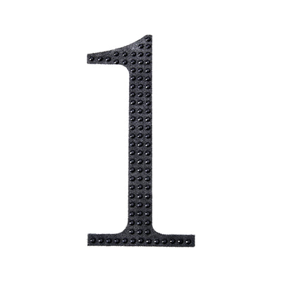Black number one cutout on a plain background