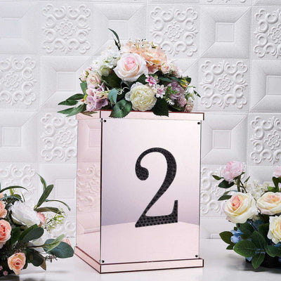 Elegant floral arrangement in a mirrored box with the number 2.