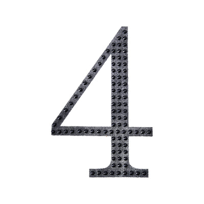 Black number four with textured dots on a white background