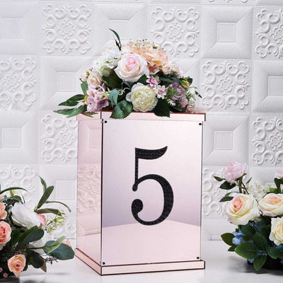 Rose gold table number holder with floral arrangement, featuring the number 5.